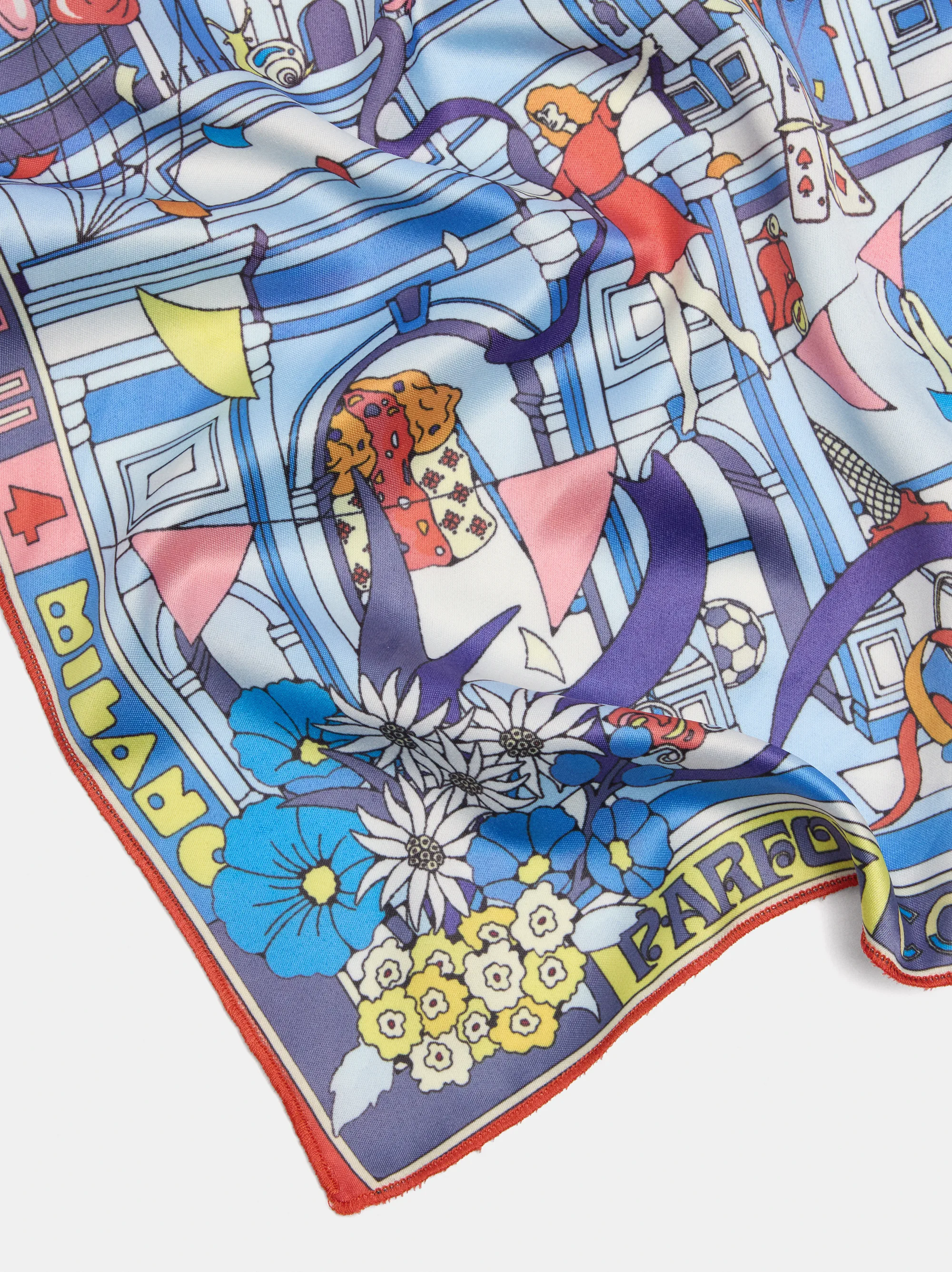 Close detail of the printed silk: flowers, arches and a leaping figure