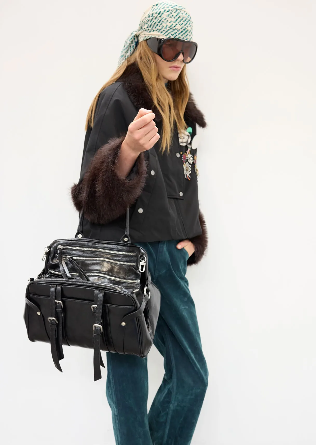 Number 26 with the studded black bag and velvet trousers