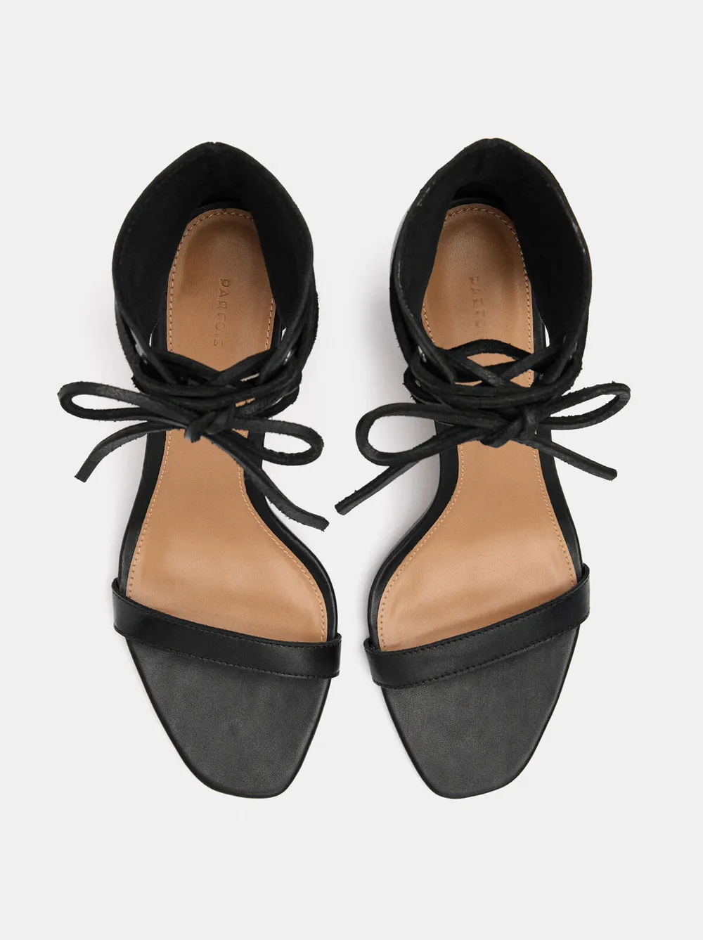Leather sandals with a heel and laces